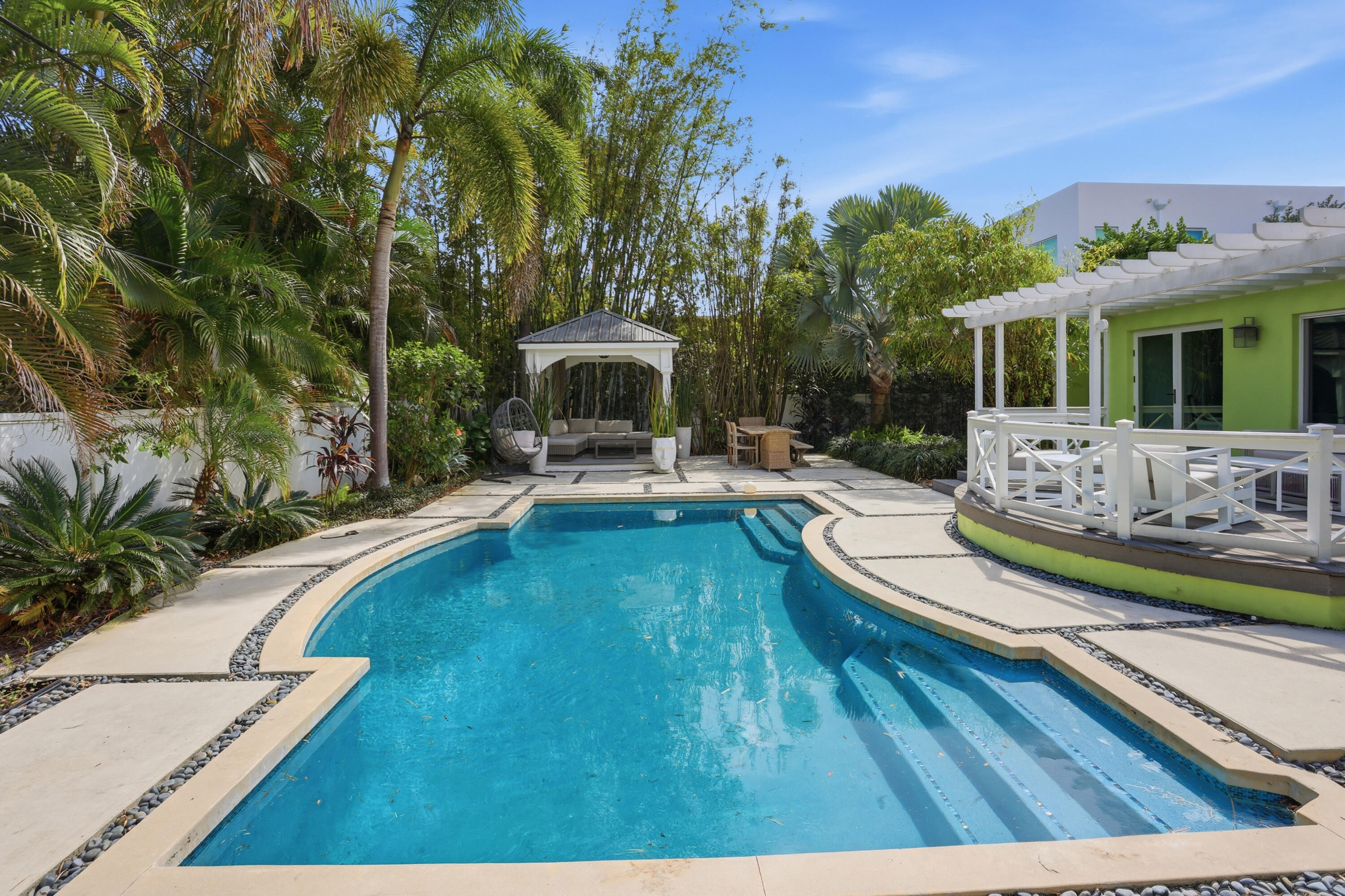 309 Northeast 8th Avenue Delray Beach, FL 33483 - Photo 38 of 43 a swimming pool with outdoor seating and yard