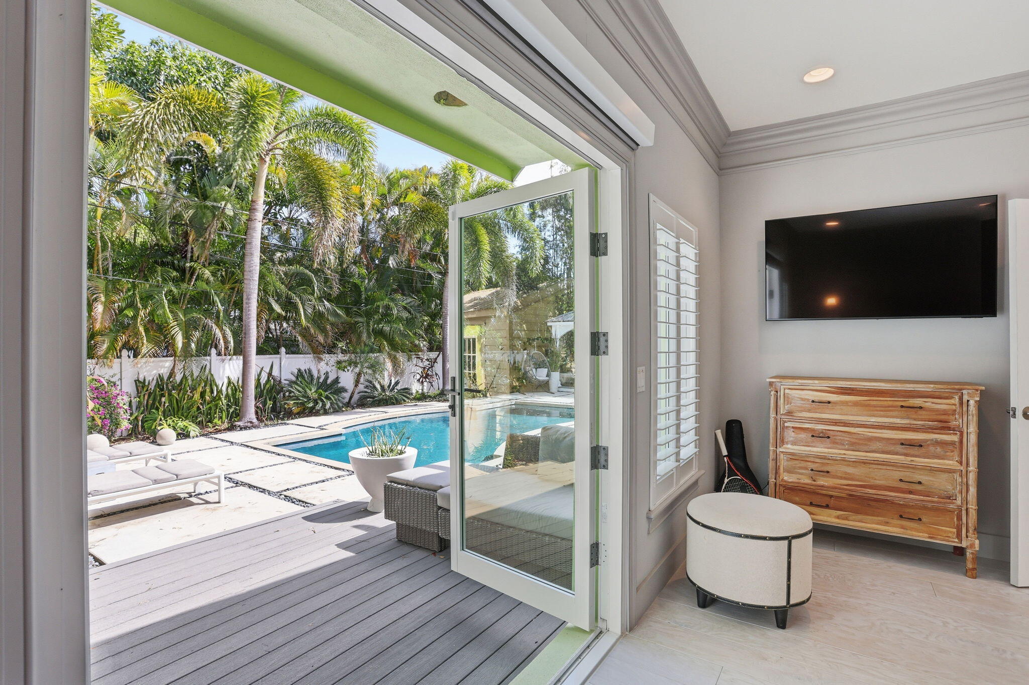 309 Northeast 8th Avenue Delray Beach, FL 33483 - Photo 4 of 43 a living room with a large window and a floor to ceiling window