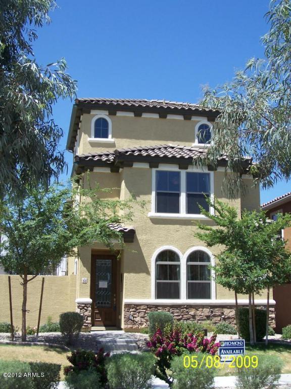 451 South Hawes Road, Unit 80 Mesa, AZ 85208 - Photo 1 of 1 a front view of a house with a garden