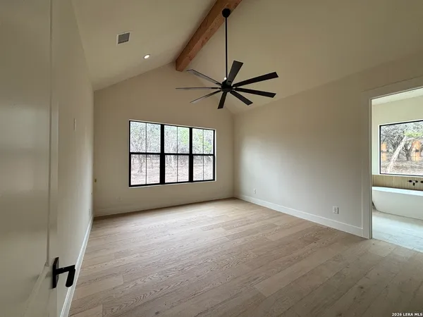 a view of an empty room with a window