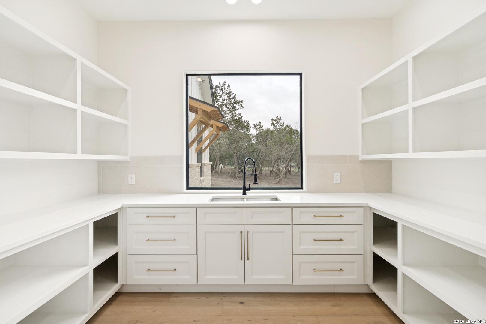 129 Aermotor Lane Boerne, TX 78006 - Photo 14 of 25 a view of cabinets and window with cabinet