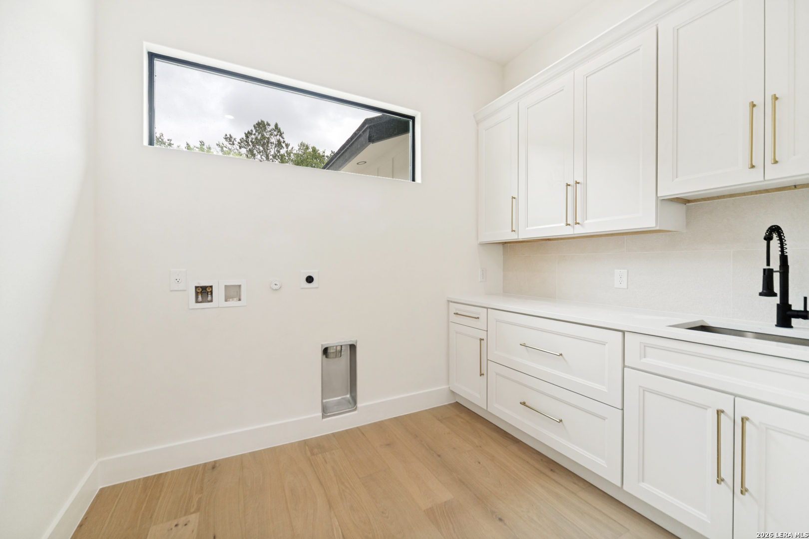 129 Aermotor Lane Boerne, TX 78006 - Photo 15 of 25 a view of cabinets with wooden floor
