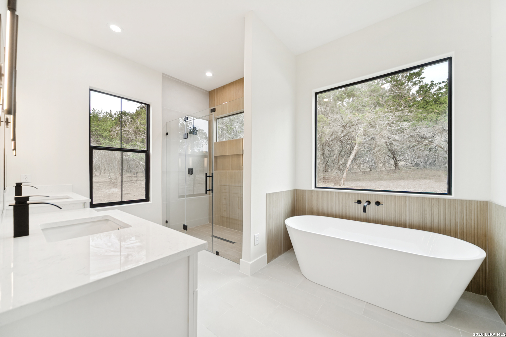 129 Aermotor Lane Boerne, TX 78006 - Photo 18 of 25 a white bath tub sitting next to a bathroom