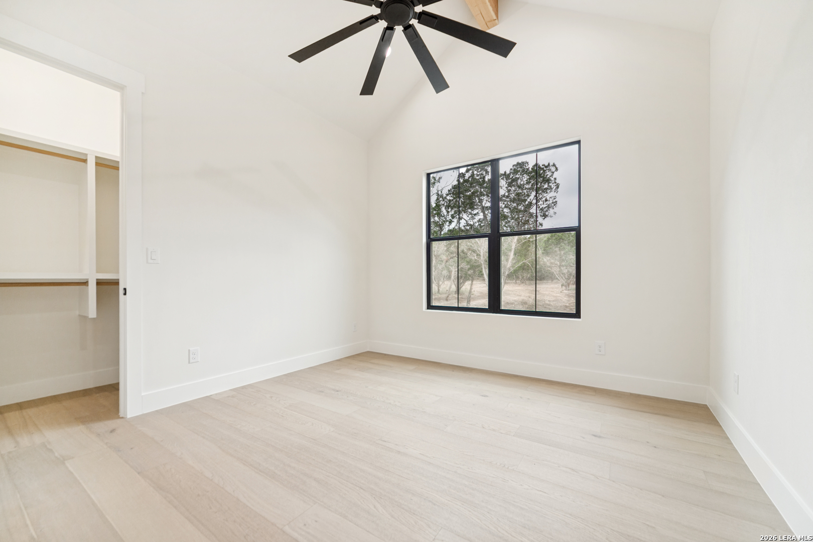 129 Aermotor Lane Boerne, TX 78006 - Photo 20 of 25 an empty room with a window and a fan