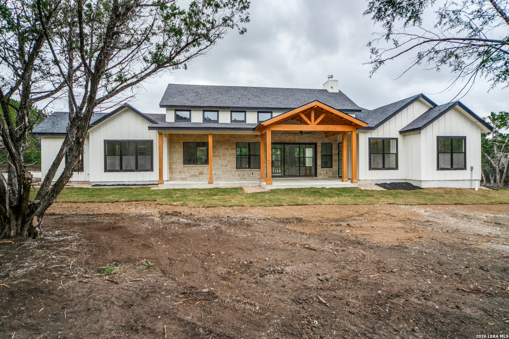 129 Aermotor Lane Boerne, TX 78006 - Photo 25 of 25 a front view of a house with a garden