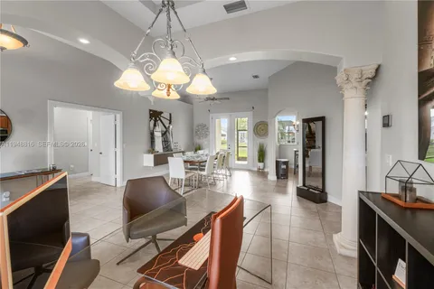 a lobby with furniture and a chandelier