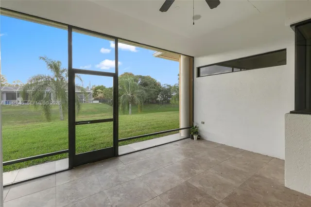 a view of a room with sliding glass door and mountain view