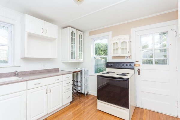 9 Blueberry Road Wareham, MA 02558 - Photo 4 of 23 a kitchen with cabinets stainless steel appliances a sink and a window