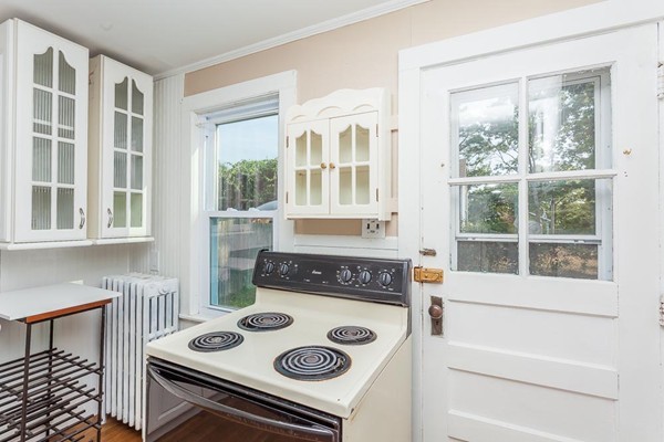 9 Blueberry Road Wareham, MA 02558 - Photo 6 of 23 a kitchen with a stove and a microwave