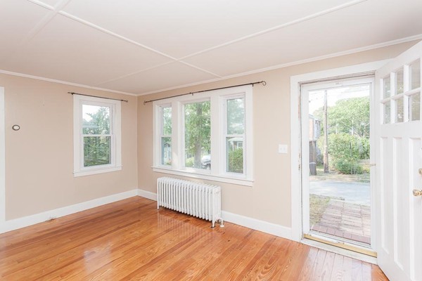 9 Blueberry Road Wareham, MA 02558 - Photo 7 of 23 a view of an empty room with wooden floor and a window