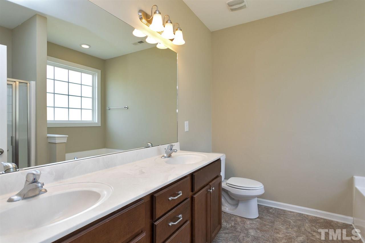 7998 Creech Road Middlesex, NC 27557 - Photo 11 of 18 Adult height counter tops, dual vanities & separate tub and shower.