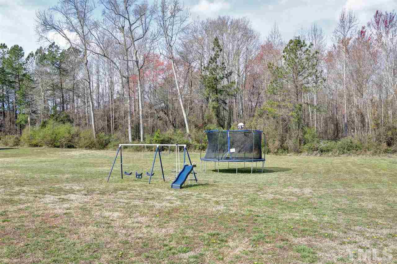7998 Creech Road Middlesex, NC 27557 - Photo 17 of 18 Plenty of room for swings, trampolines and the family pet to run and jump.