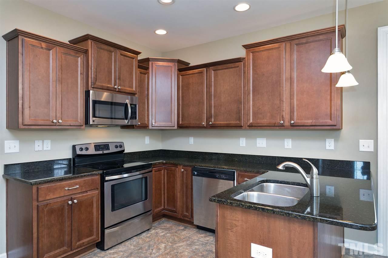 7998 Creech Road Middlesex, NC 27557 - Photo 5 of 18 Stainless steel appliances, recessed lights, pendant lights over eat-at bar area.