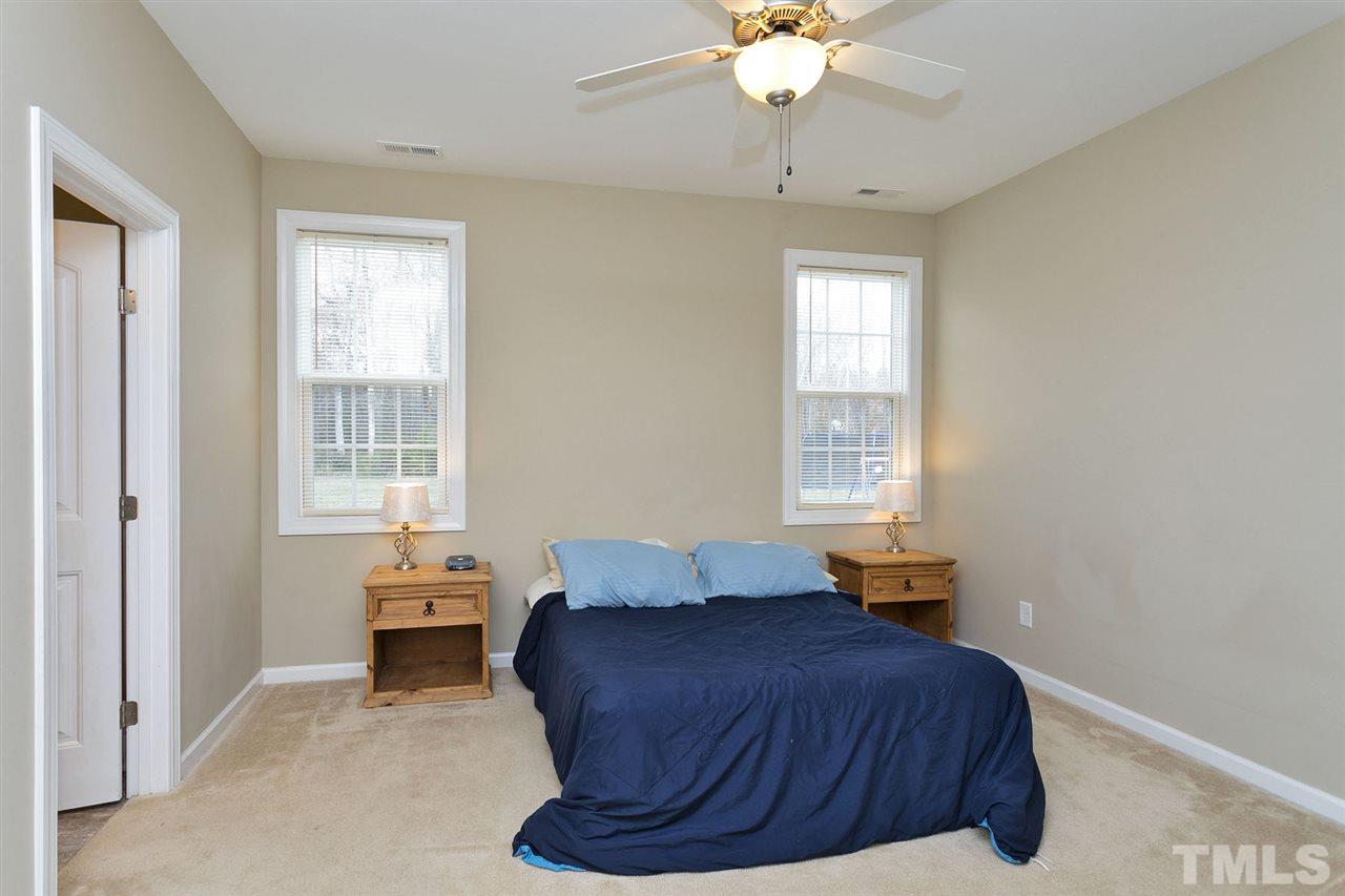 7998 Creech Road Middlesex, NC 27557 - Photo 10 of 18 Elegant and spacious master bedroom will fit all your furniture requirements. Large walk in closet too.