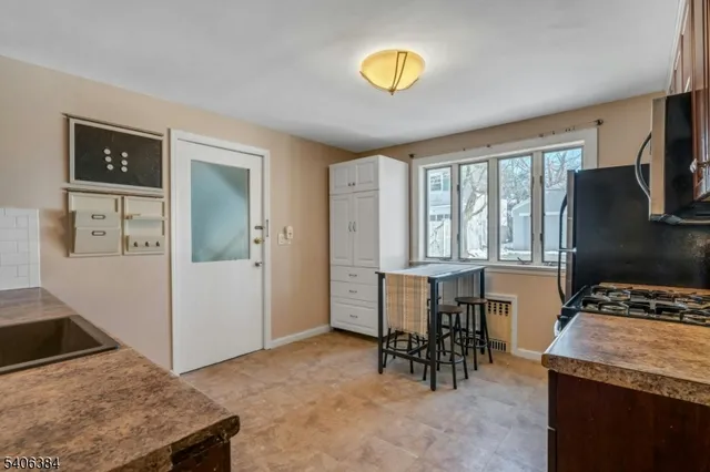 a view of kitchen with furniture and a stove