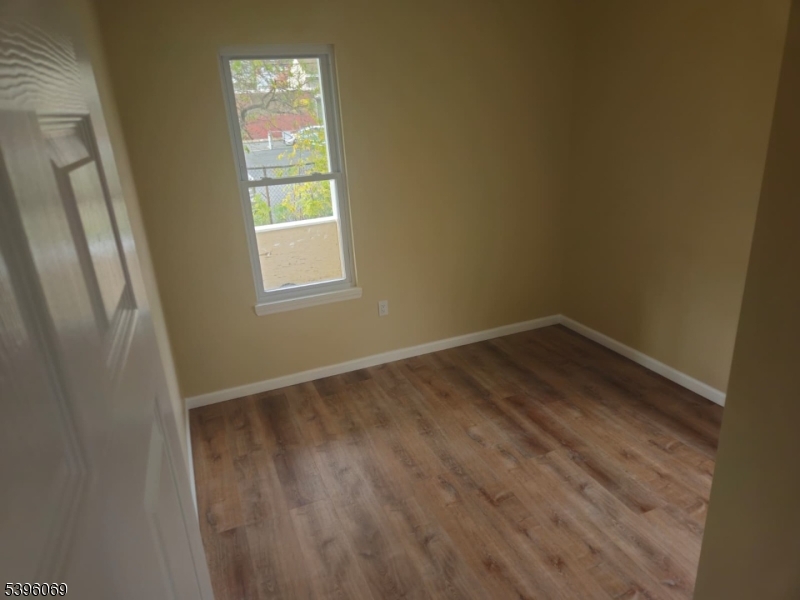 518 East 23rd Street, Unit 1F Paterson, NJ 07514 - Photo 4 of 4 a view of an empty room and window