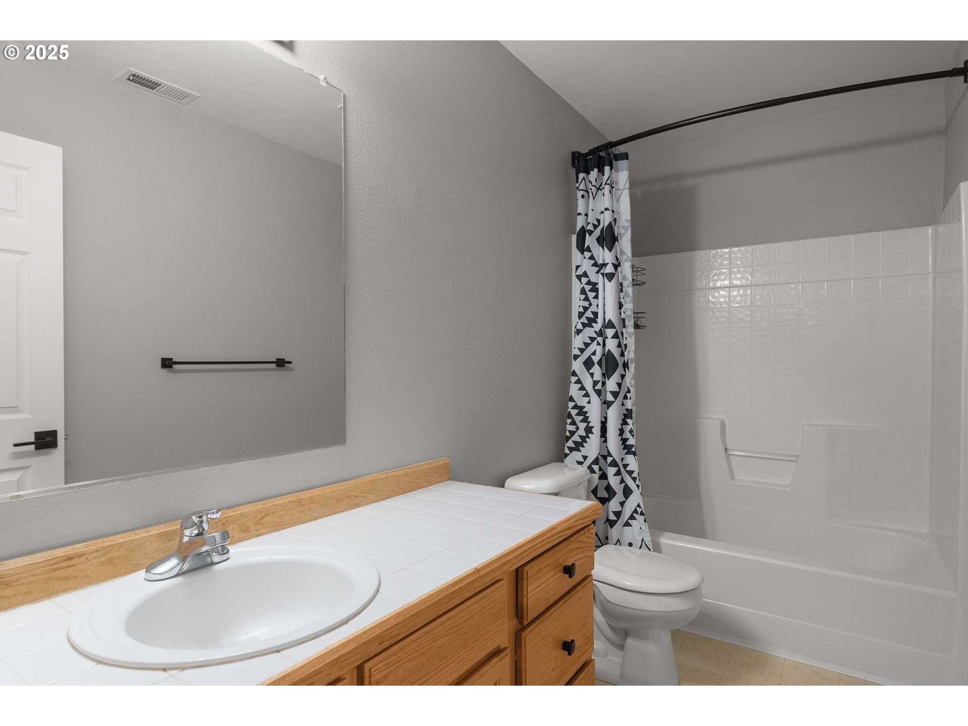 3255 Southwest 179th Terrace Beaverton, OR 97003 - Photo 27 of 38 a bathroom with a sink a toilet and a mirror