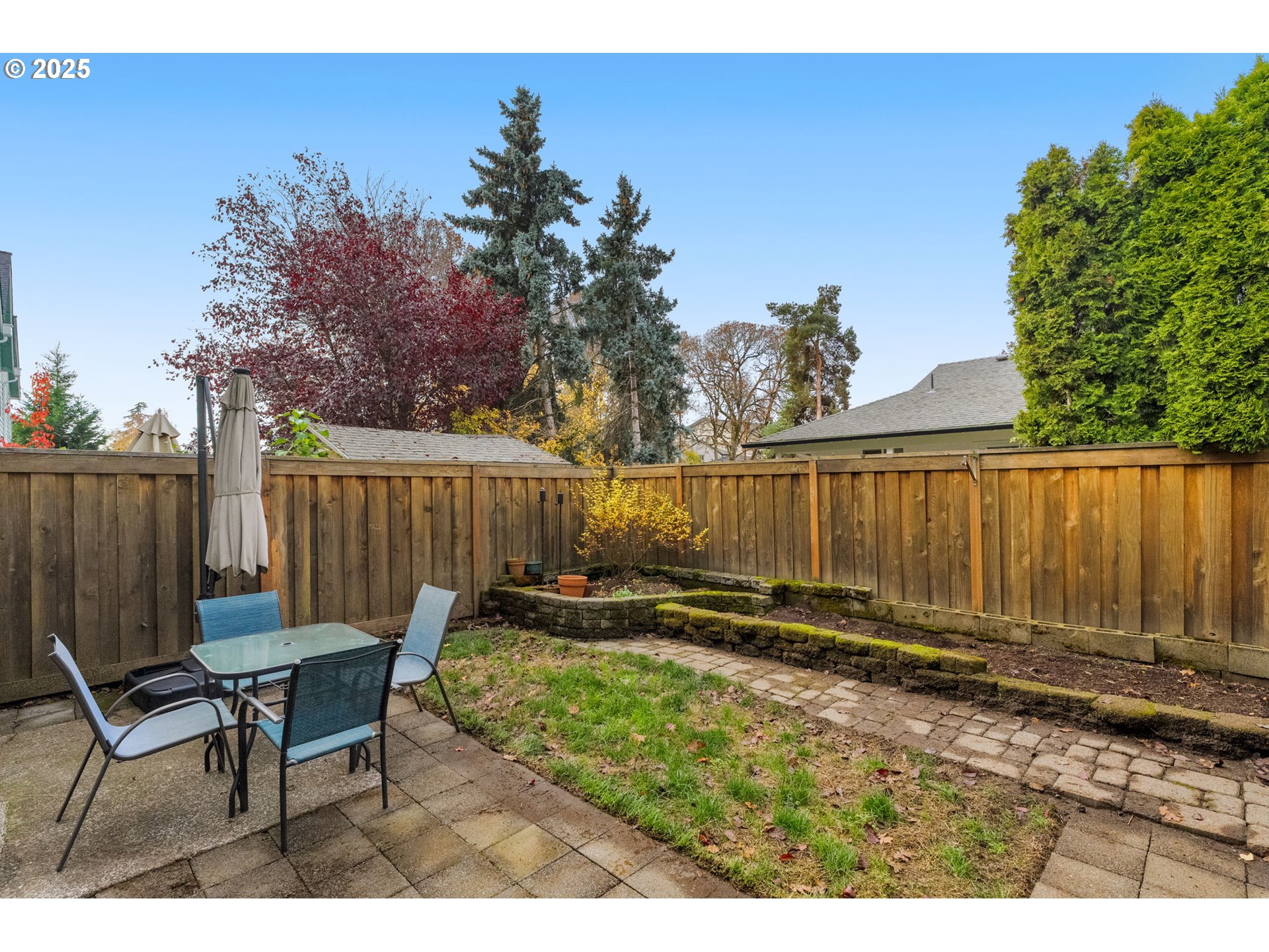 3255 Southwest 179th Terrace Beaverton, OR 97003 - Photo 34 of 38 a backyard of a house with table and chairs