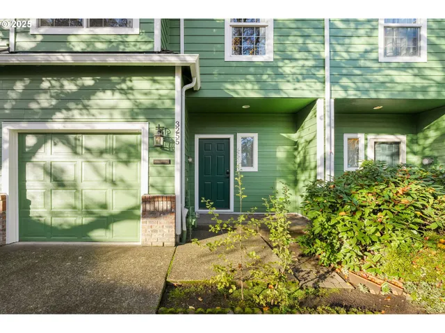 a view of a brick house with a large windows