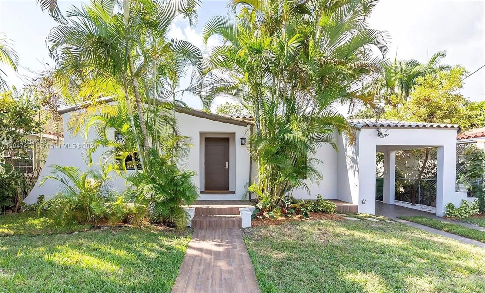 332 Southwest 20th Road Miami, FL 33129 - Photo 1 of 23 a view of a house with a yard and plants