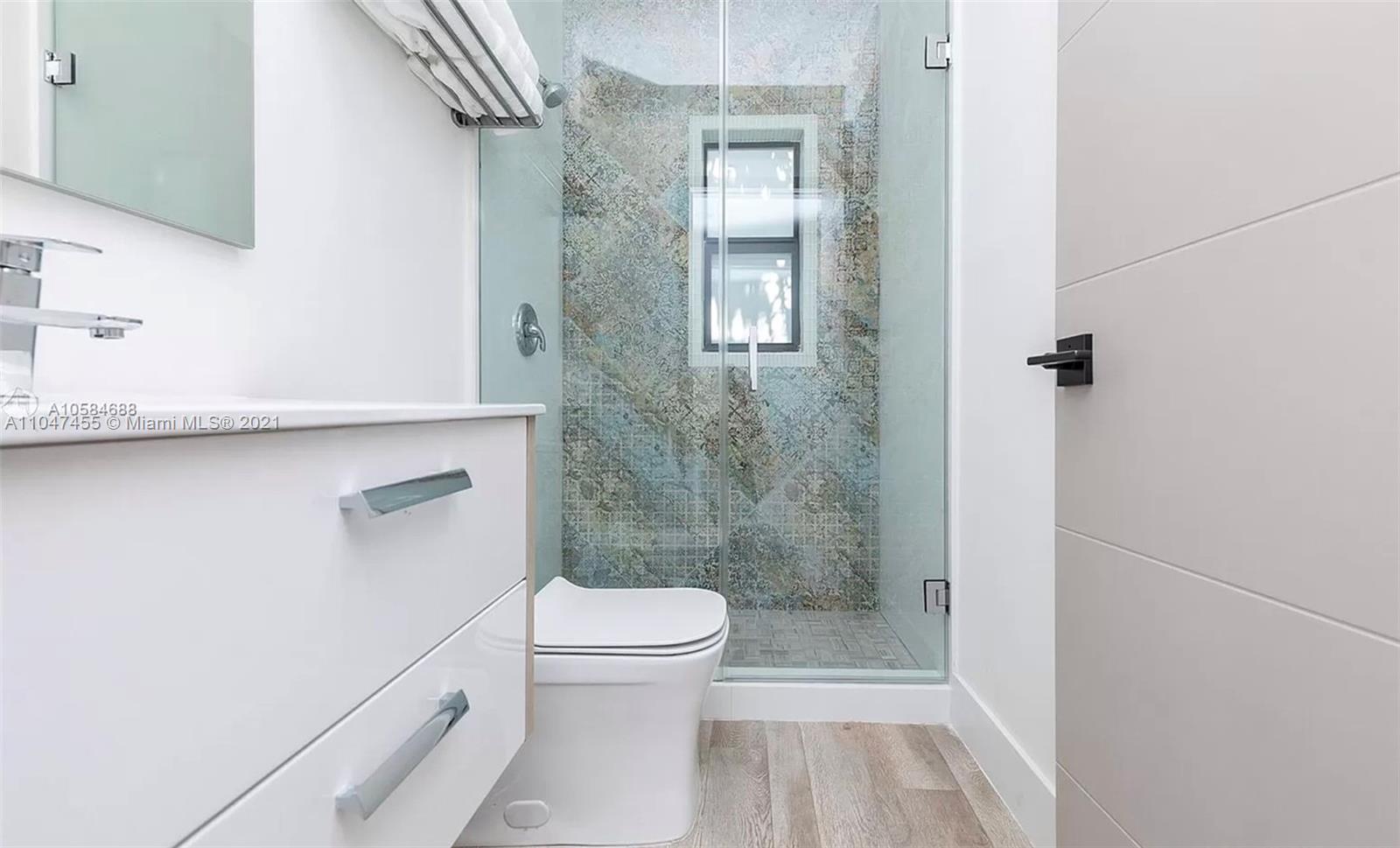 332 Southwest 20th Road Miami, FL 33129 - Photo 16 of 23 a bathroom with a toilet and a shower