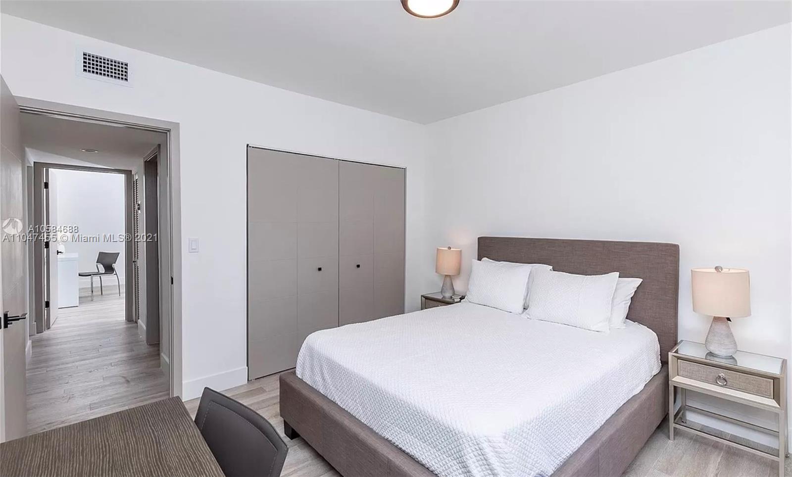 332 Southwest 20th Road Miami, FL 33129 - Photo 19 of 23 a bedroom with a bed and a mirror