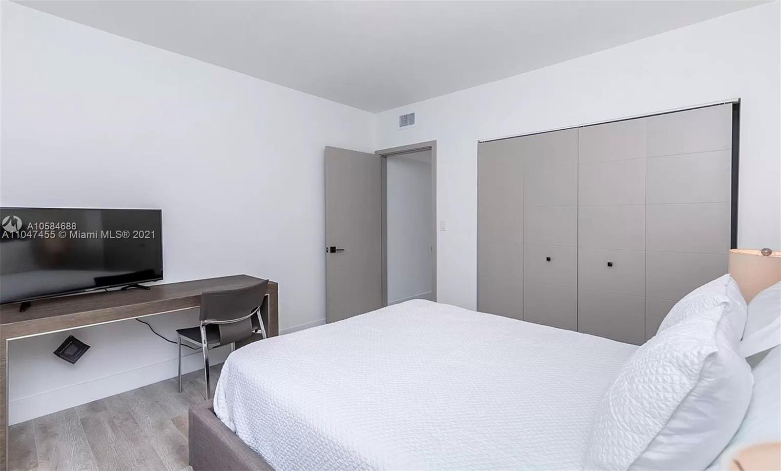 332 Southwest 20th Road Miami, FL 33129 - Photo 20 of 23 a bedroom with a bed and a desk