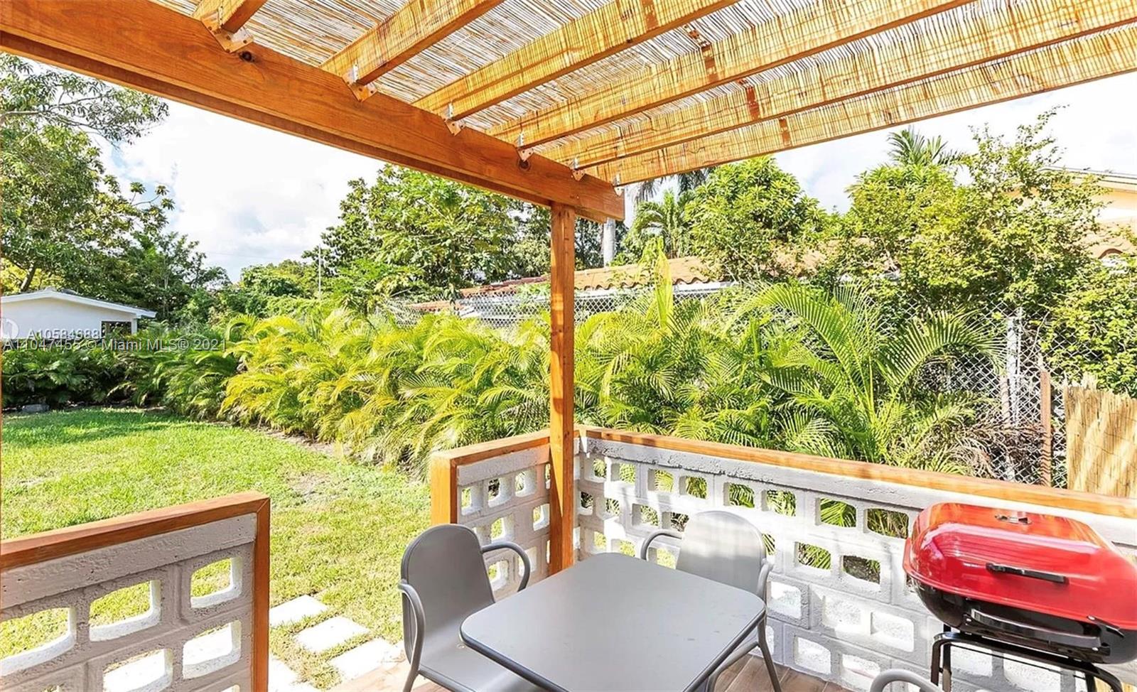 332 Southwest 20th Road Miami, FL 33129 - Photo 22 of 23 a view of a chair and table in the patio