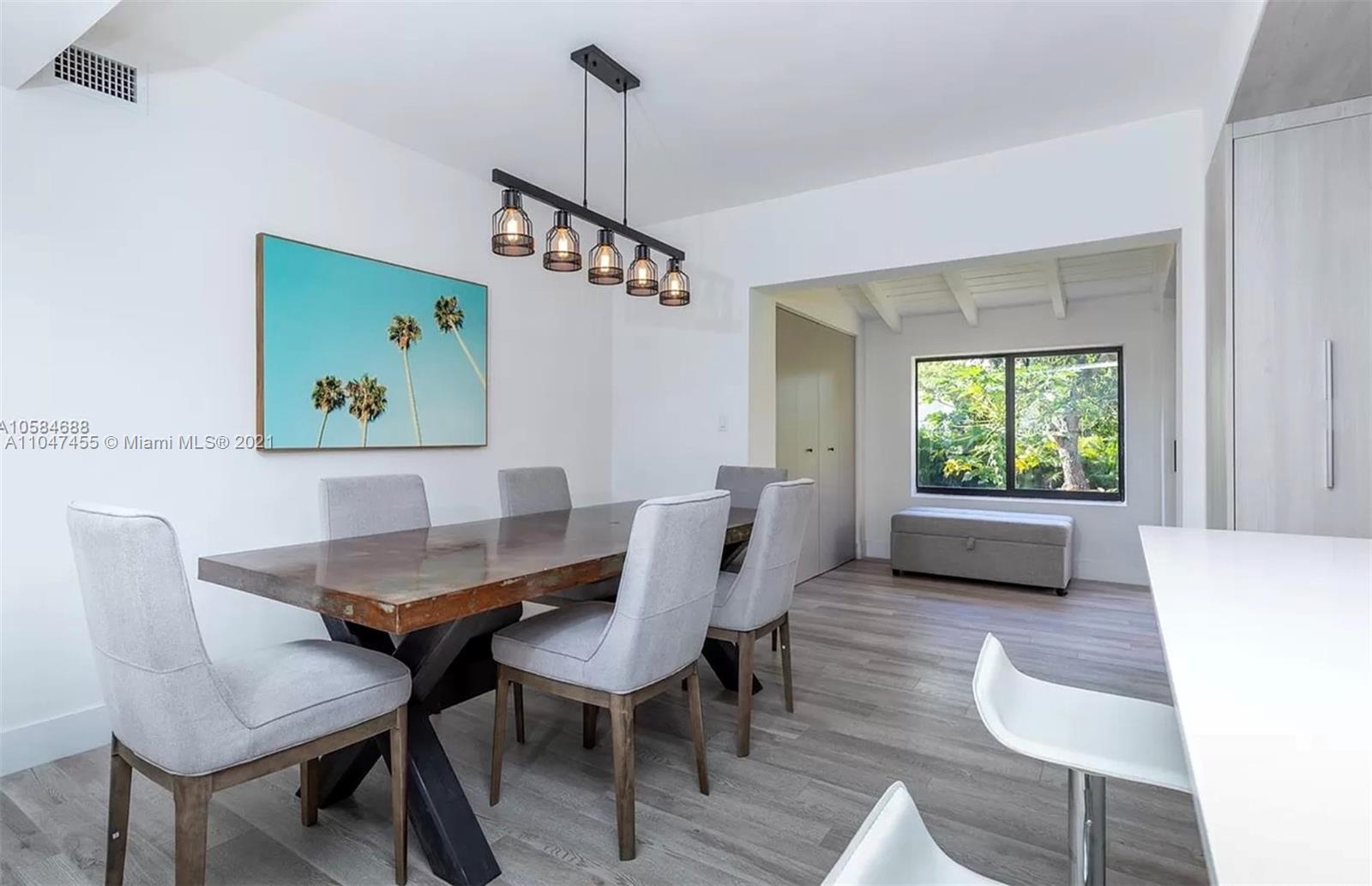332 Southwest 20th Road Miami, FL 33129 - Photo 5 of 23 a view of a dining room with furniture window and wooden floor