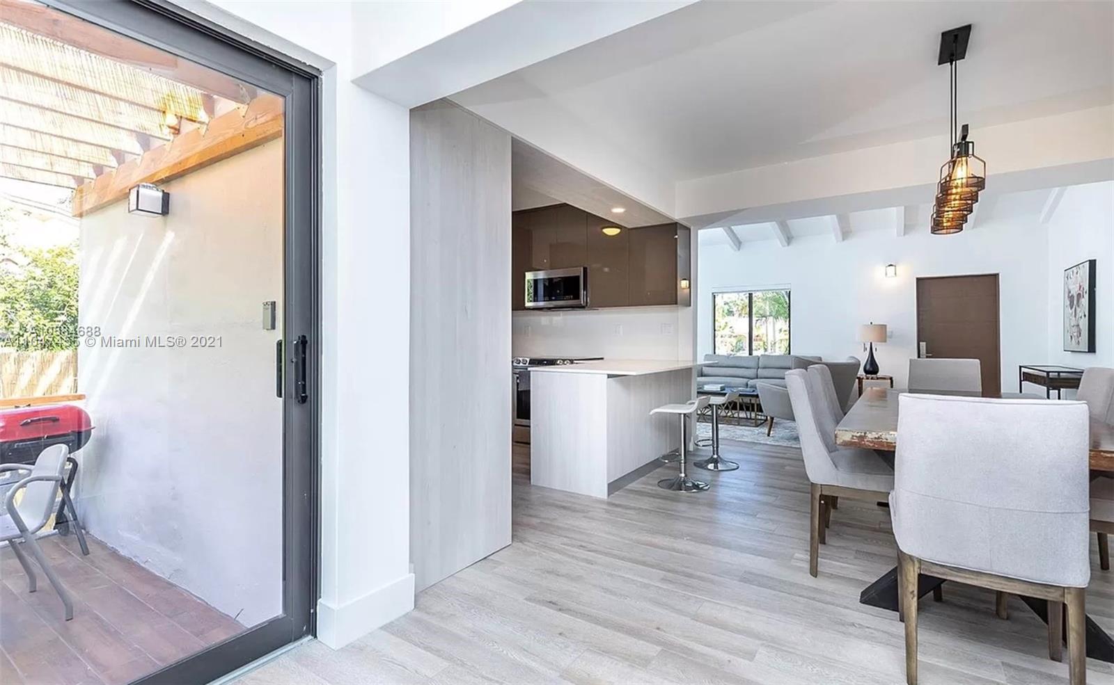 332 Southwest 20th Road Miami, FL 33129 - Photo 7 of 23 a view of a dining room with furniture window and wooden floor