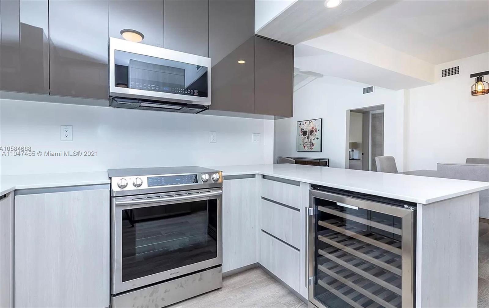332 Southwest 20th Road Miami, FL 33129 - Photo 10 of 23 a kitchen with a stove and a microwave