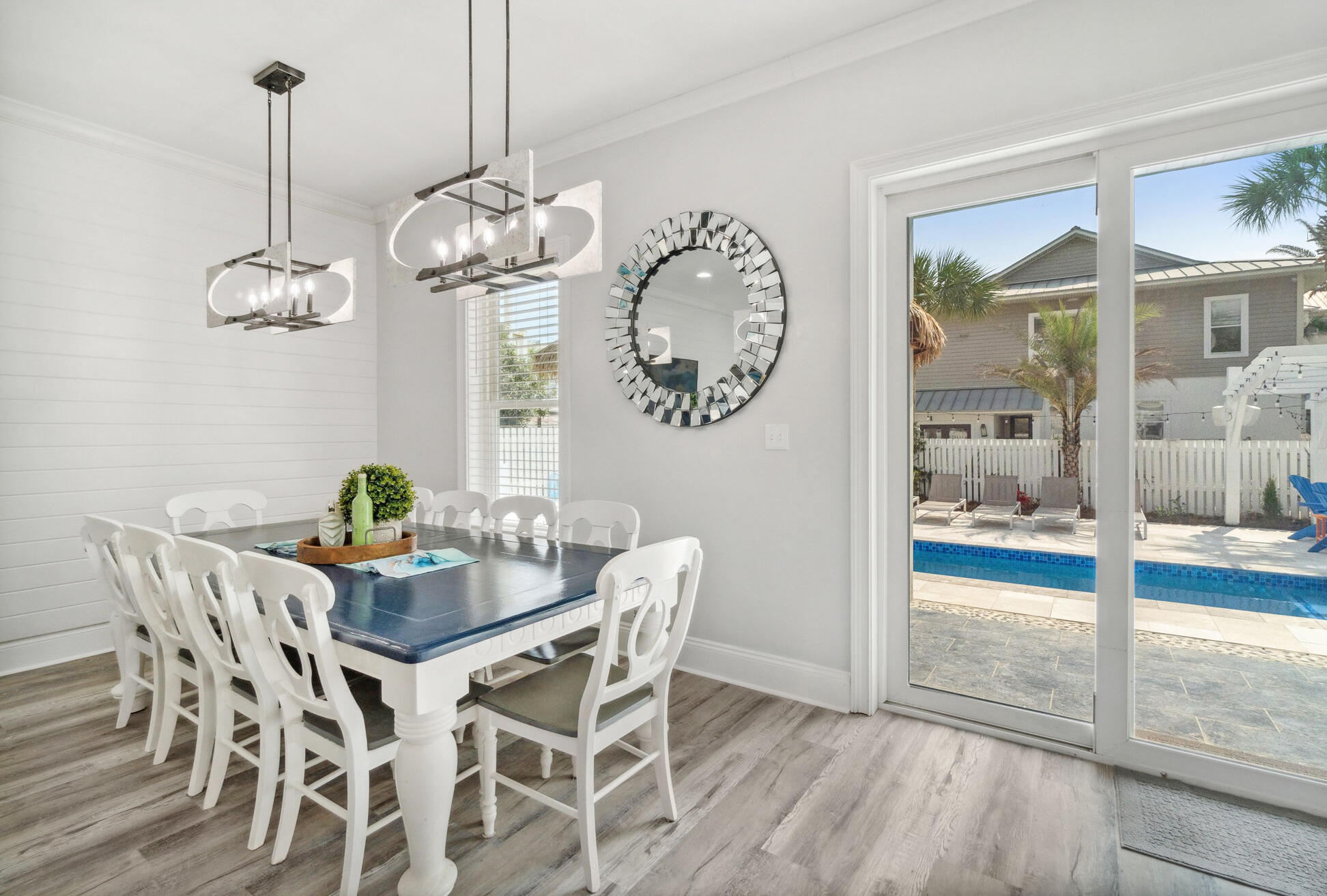 29 Sarasota Street Miramar Beach, FL 32550 - Photo 14 of 66 a view of a dining room with furniture wooden floor and a chandelier