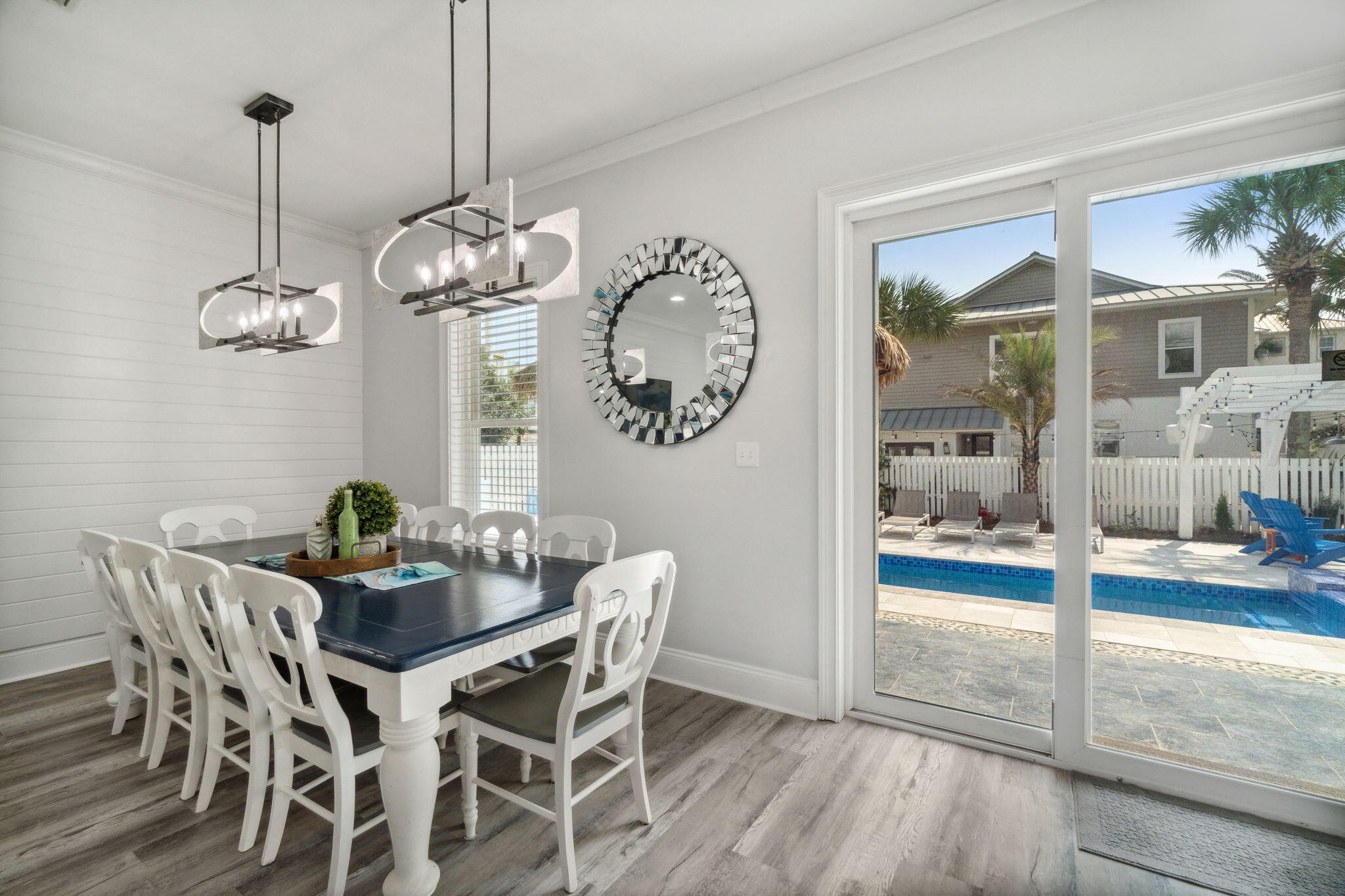 29 Sarasota Street Miramar Beach, FL 32550 - Photo 15 of 66 a view of a dining room with furniture wooden floor and a chandelier