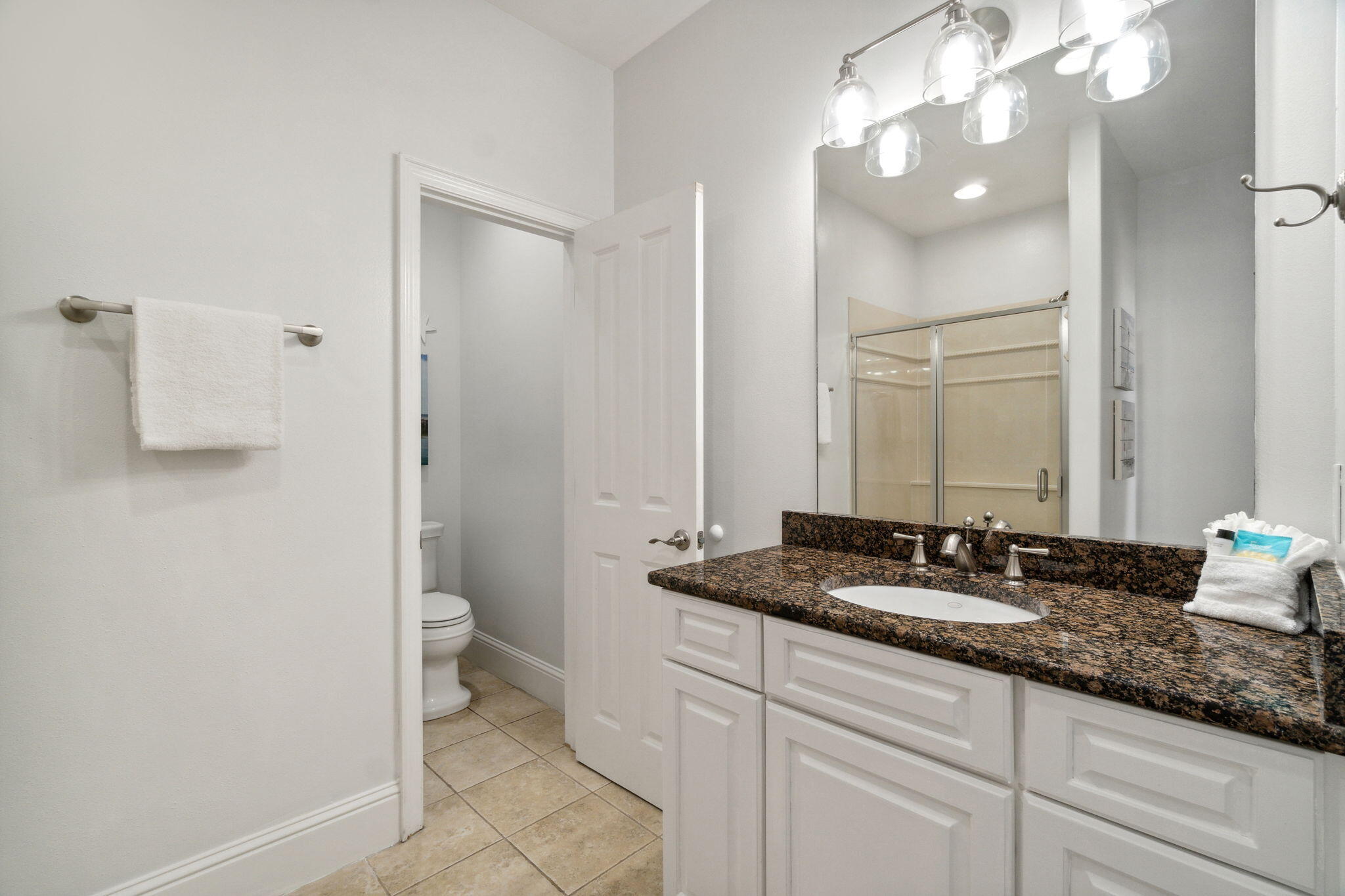 29 Sarasota Street Miramar Beach, FL 32550 - Photo 23 of 66 a bathroom with a granite countertop sink a toilet and a mirror