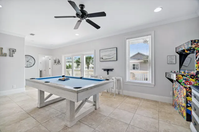 a bedroom with a bed lamp and a window