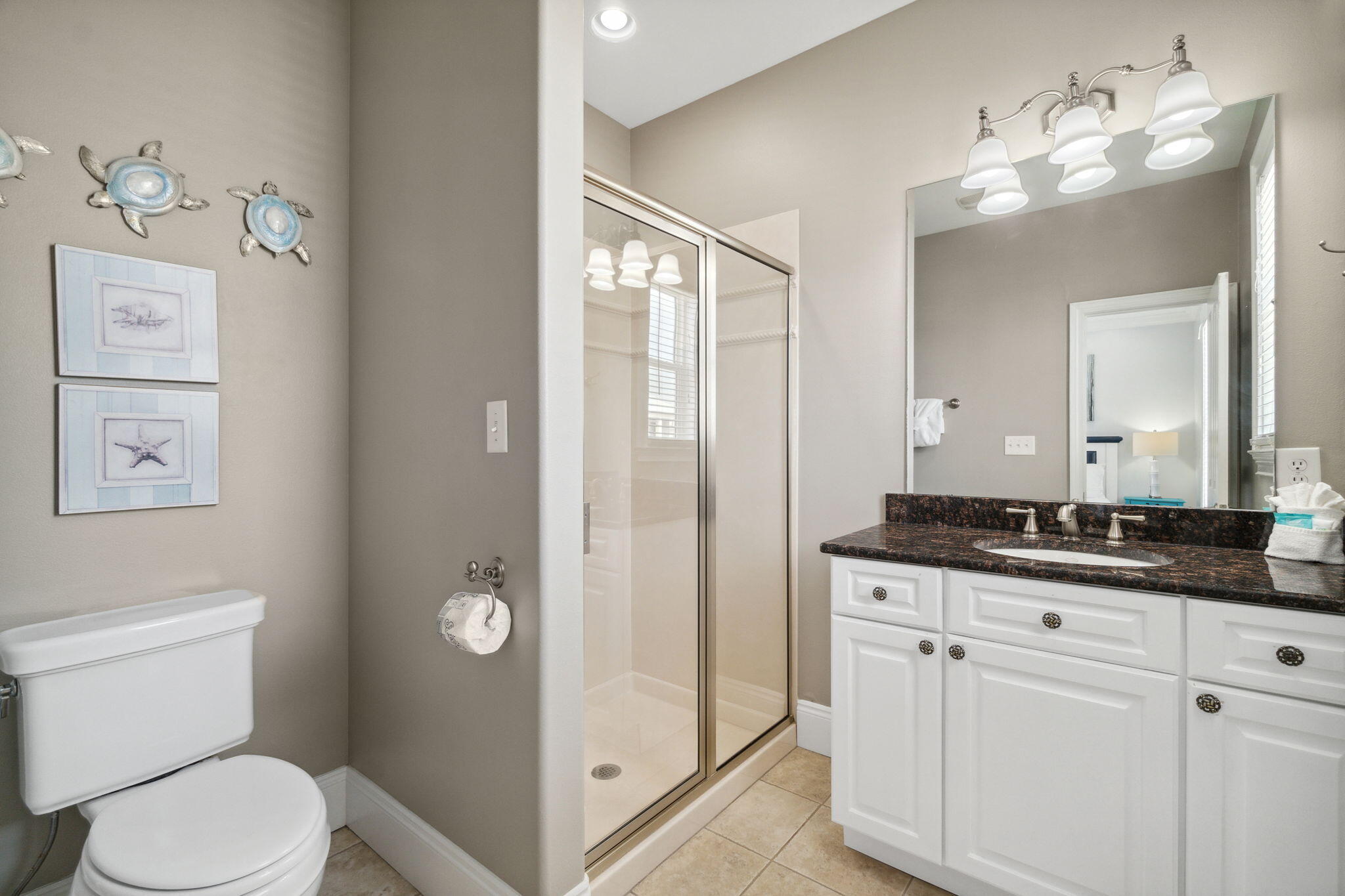 29 Sarasota Street Miramar Beach, FL 32550 - Photo 38 of 66 a bathroom with a granite countertop sink mirror vanity and toilet