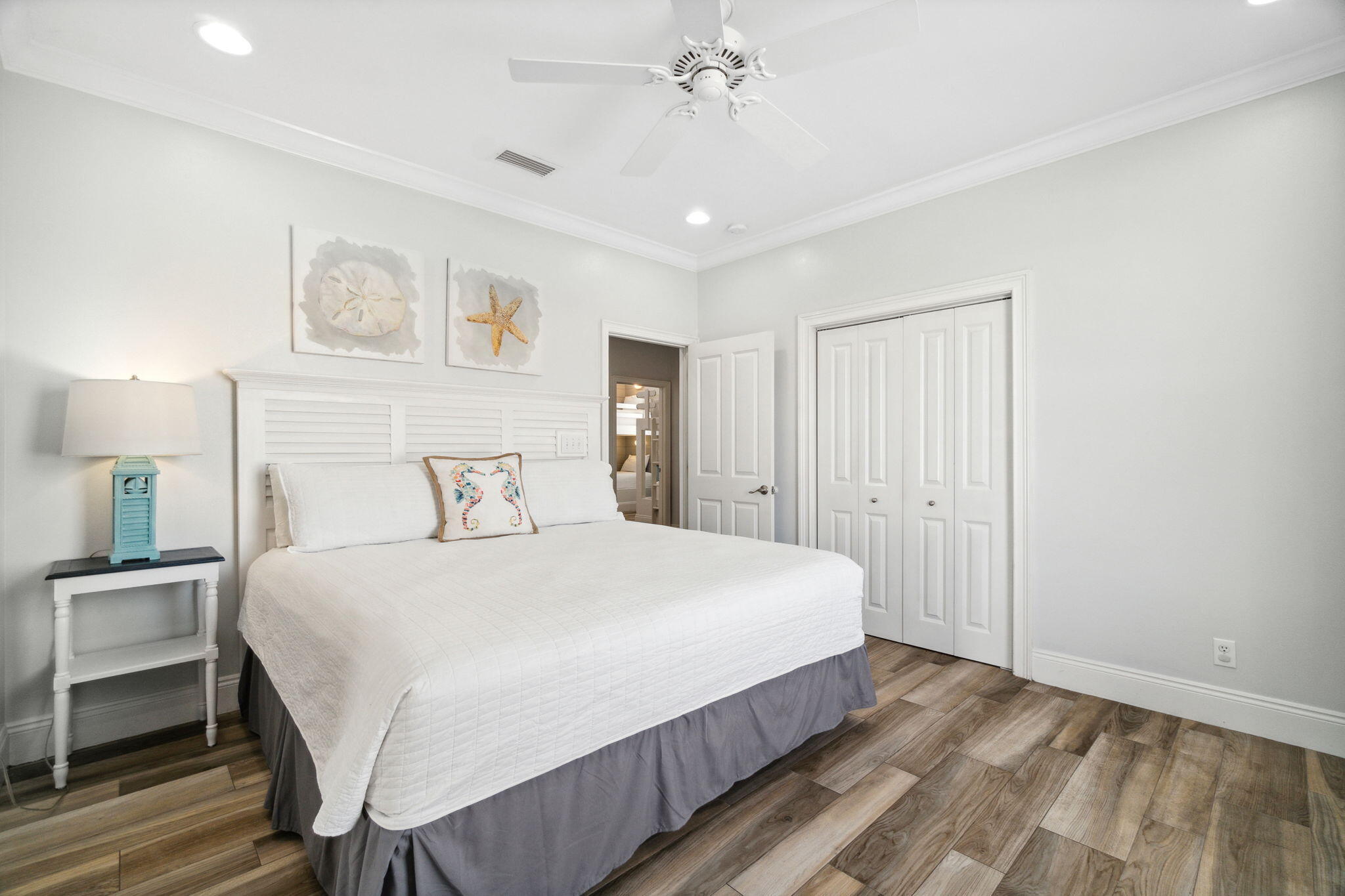 29 Sarasota Street Miramar Beach, FL 32550 - Photo 40 of 66 a bedroom with a bed and a chandelier