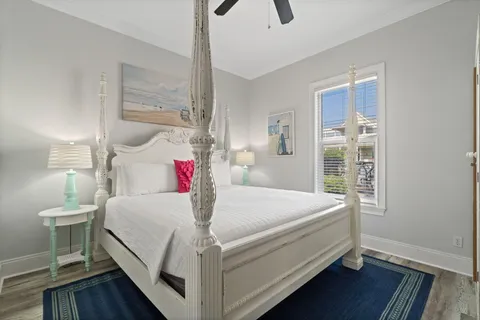 a bedroom with a bed and a flat screen tv in it