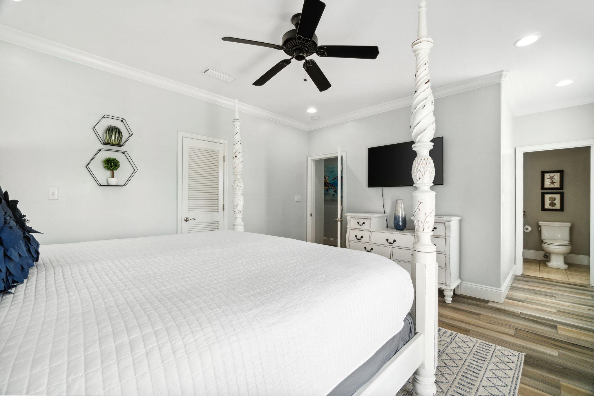 29 Sarasota Street Miramar Beach, FL 32550 - Photo 44 of 66 a bedroom with a bed and a flat tv screen on dresser