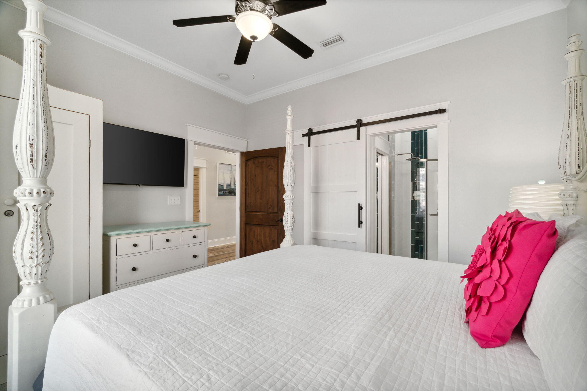 29 Sarasota Street Miramar Beach, FL 32550 - Photo 5 of 66 a bedroom with a bed and a flat screen tv in it