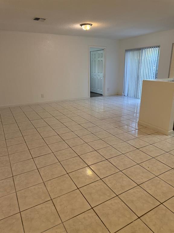 1 Crossing Circle, Unit C Boynton Beach, FL 33435 - Photo 4 of 12 a view of an empty room and a window