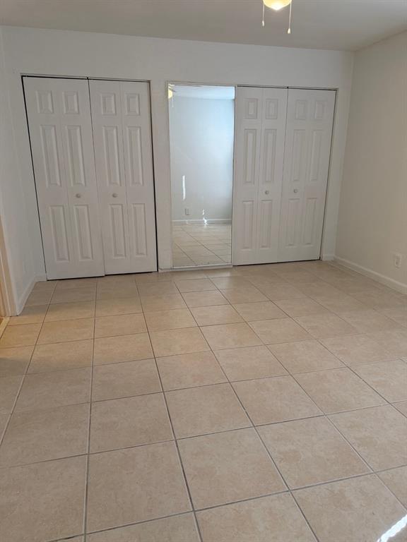 1 Crossing Circle, Unit C Boynton Beach, FL 33435 - Photo 5 of 12 a view of a livingroom with an empty space and a window
