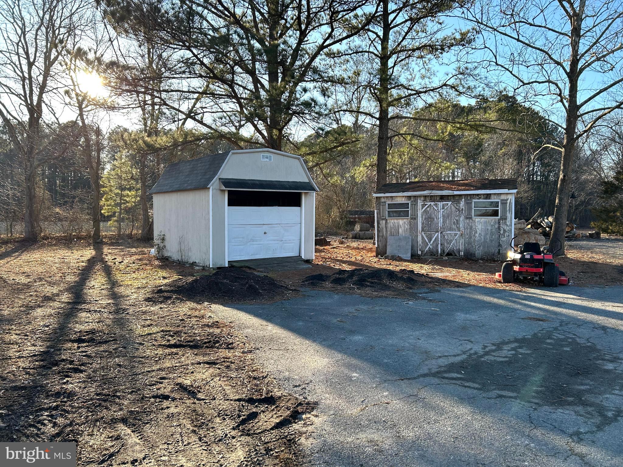 3450 Indian Bone Road Cambridge, MD 21613 - Photo 5 of 14 a view of a house with a yard covered in snow