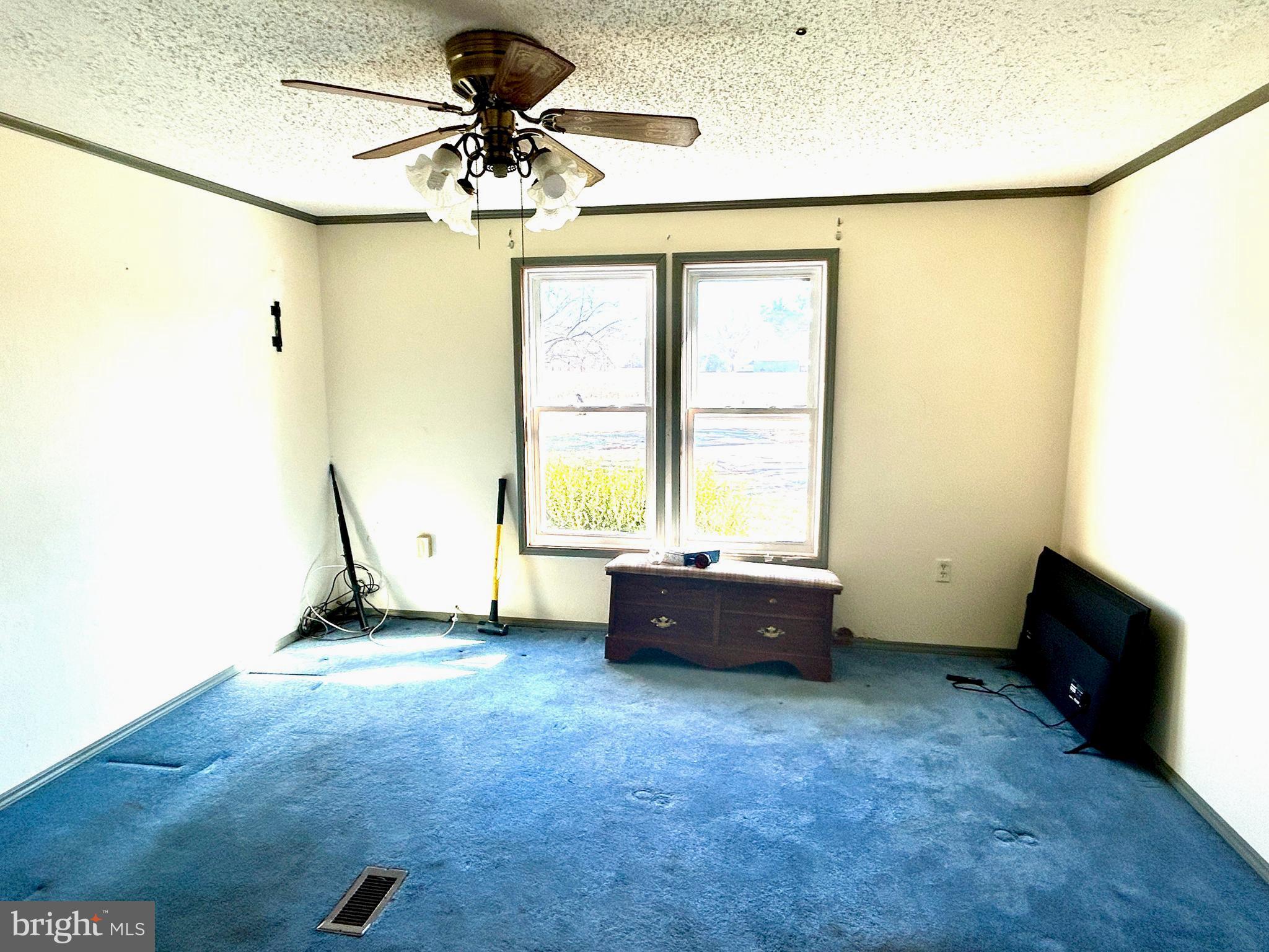 3450 Indian Bone Road Cambridge, MD 21613 - Photo 10 of 14 a room with a window and a ceiling fan