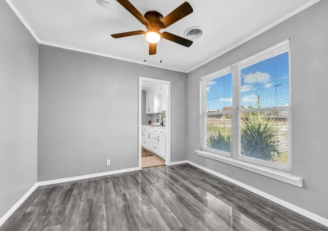 a view of an empty room with a window