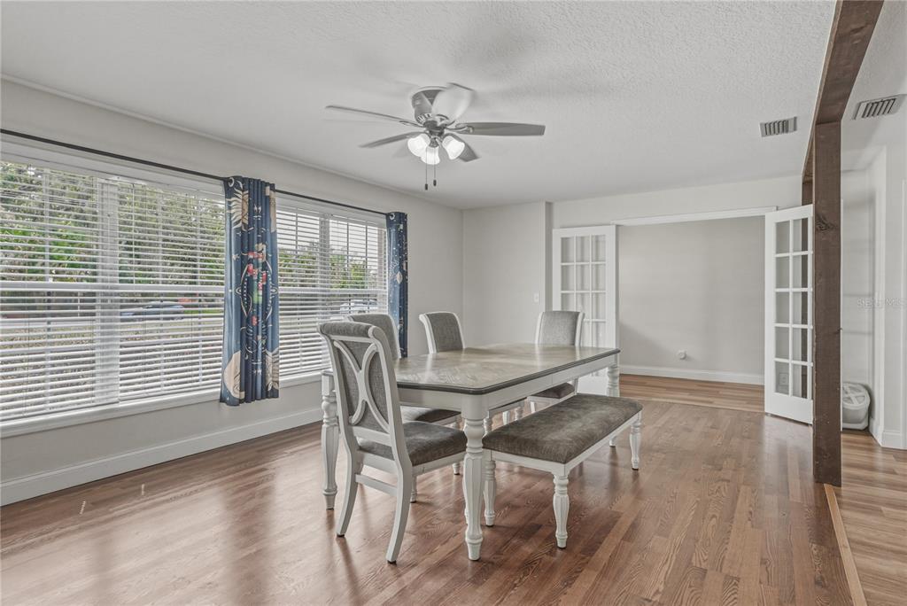 609 West Pipkin Road Lakeland, FL 33813 - Photo 24 of 72 a view of a dining room with furniture window and wooden floor