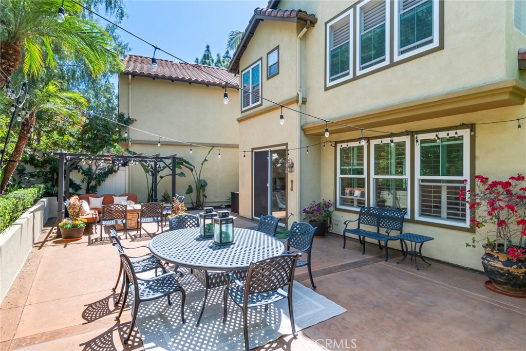 2515 Lewis Drive Tustin, CA 92782 - Photo 25 of 34 a view of a patio with table and chairs and potted plants