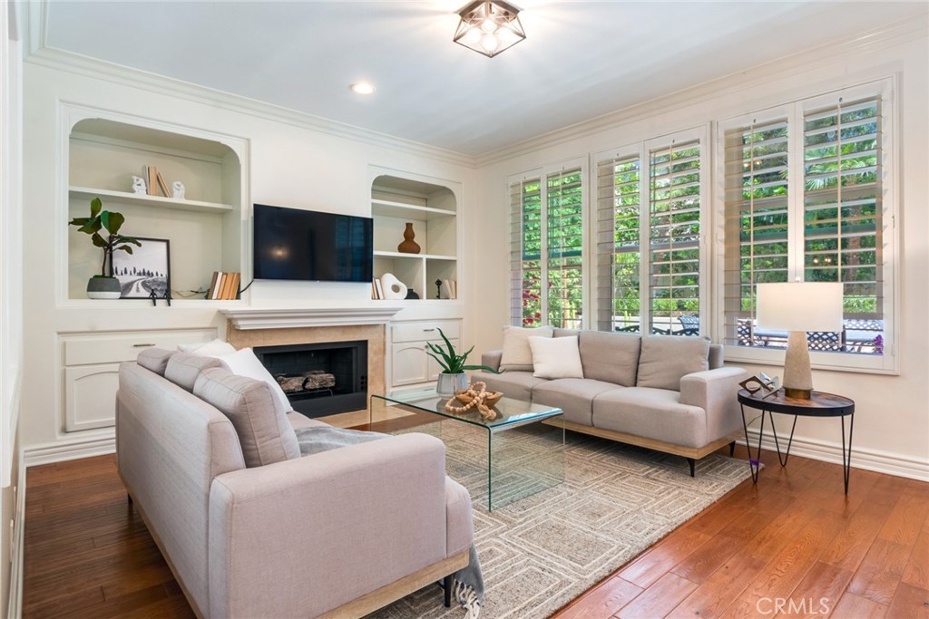 2515 Lewis Drive Tustin, CA 92782 - Photo 7 of 34 a living room with furniture a fireplace and a flat screen tv