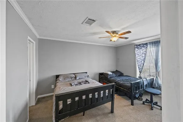 a view of hallway with wooden floor