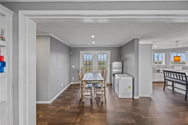 a living room with furniture a ceiling fan and a window
